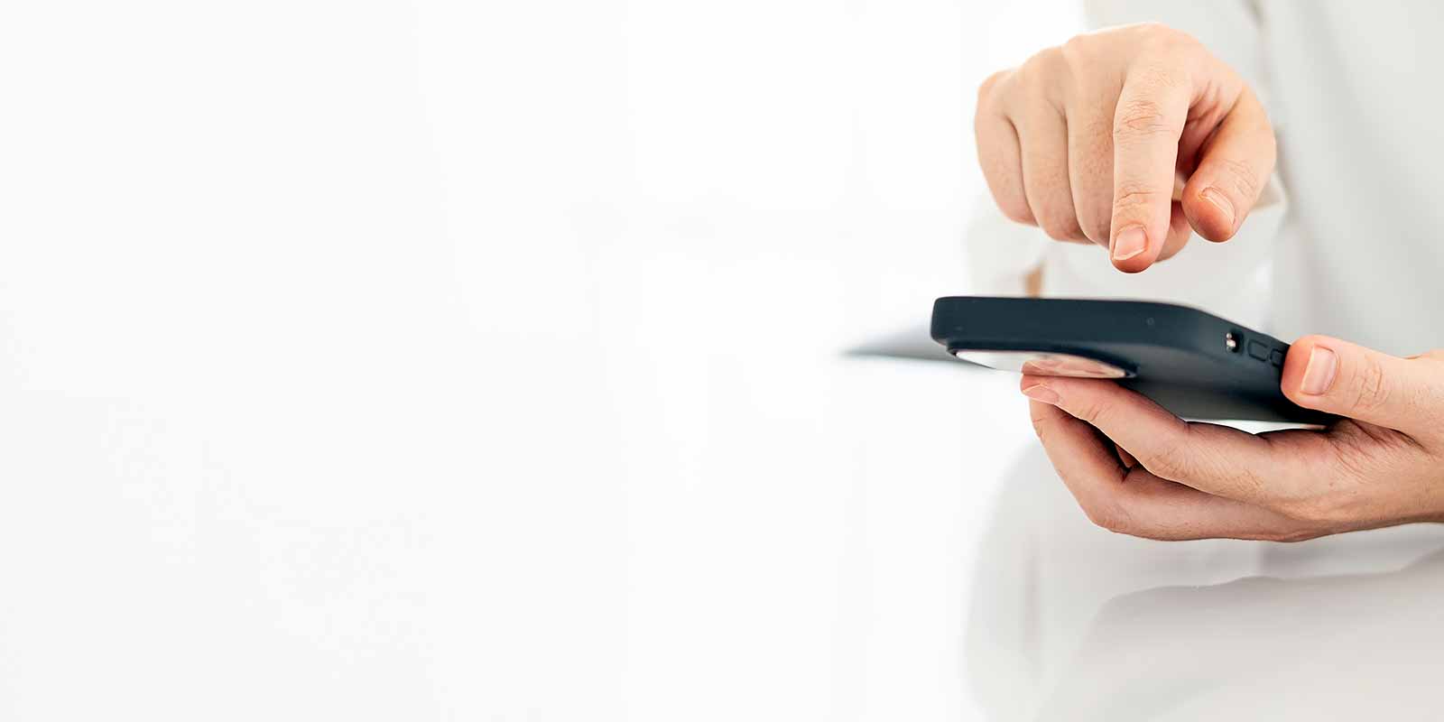 man typing on phone